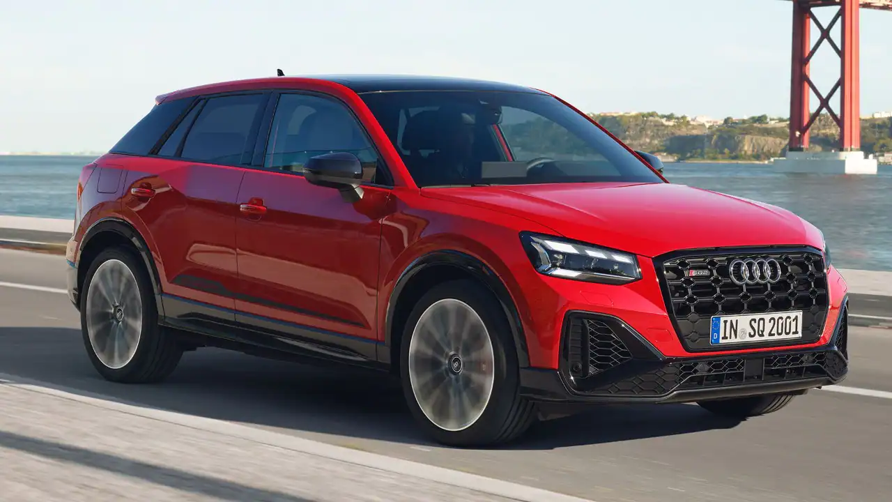 audi sq2 driving on a road
