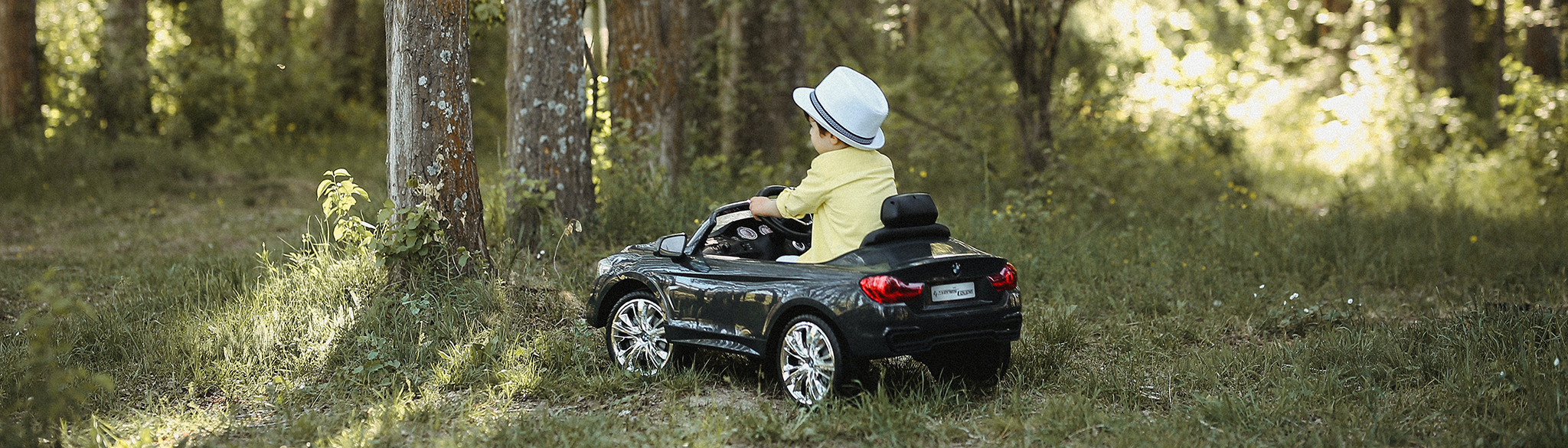 Child driving toy car