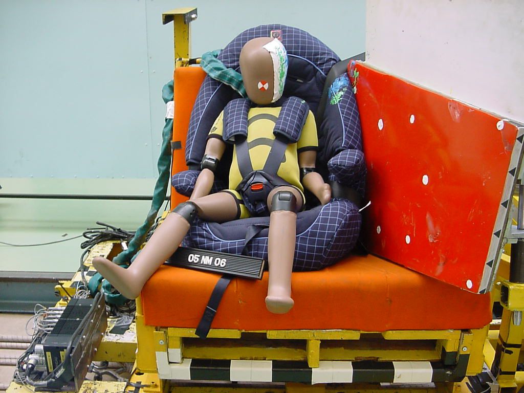 Child crash dummy in a car seat