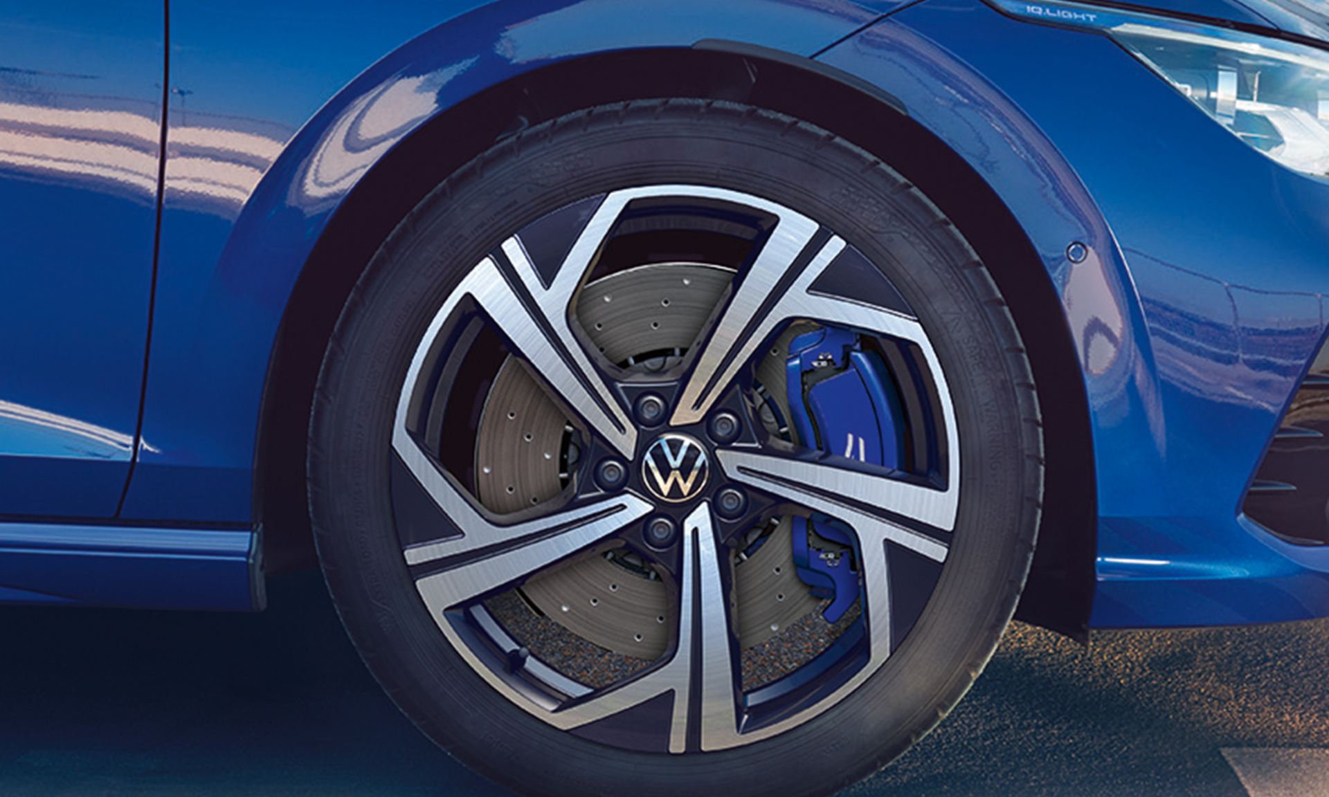 close up of Golf R estate alloy wheel and blue brake caliper