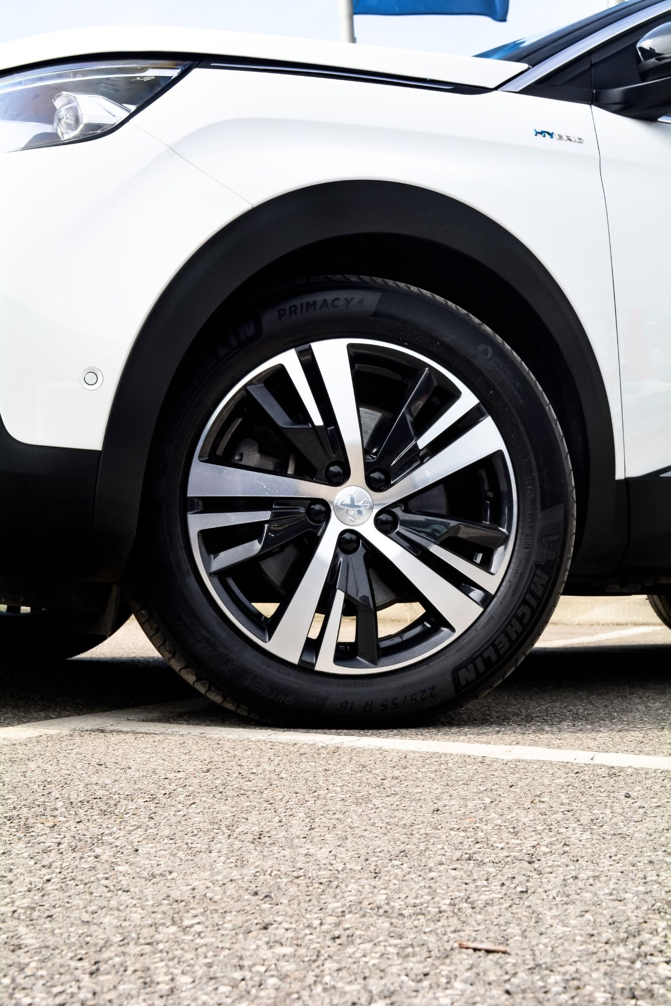 close up of white peugeot 3008 alloy wheel