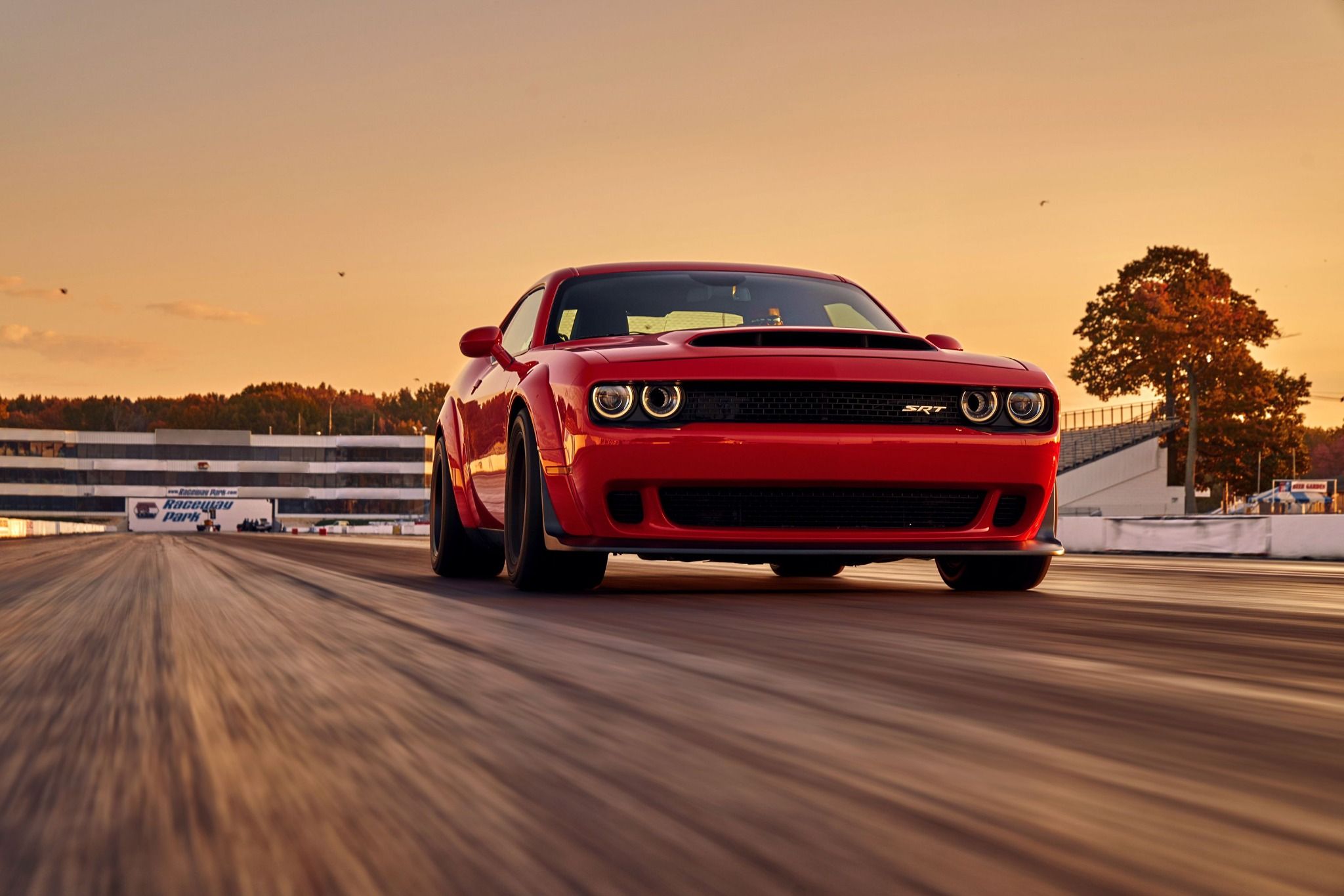 Front view of a Dodge Demon driving down the road