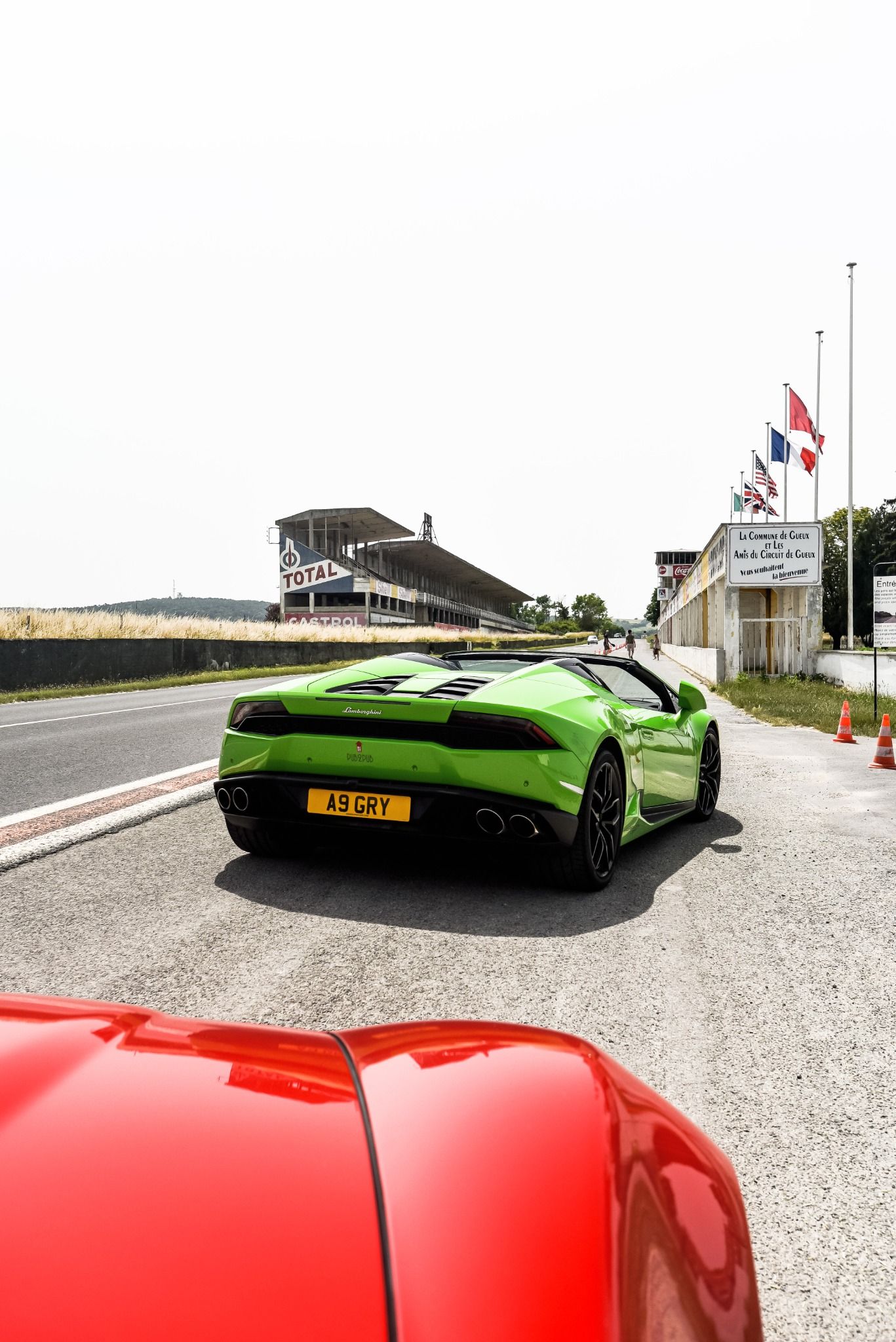 Rear angle on a green Lamborghini on a racing track
