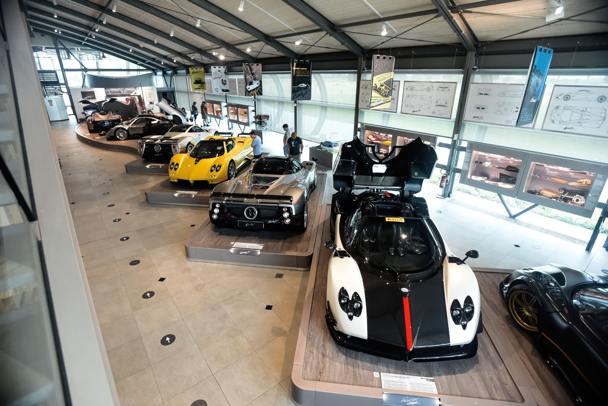 Room full of sports cars in a showroom