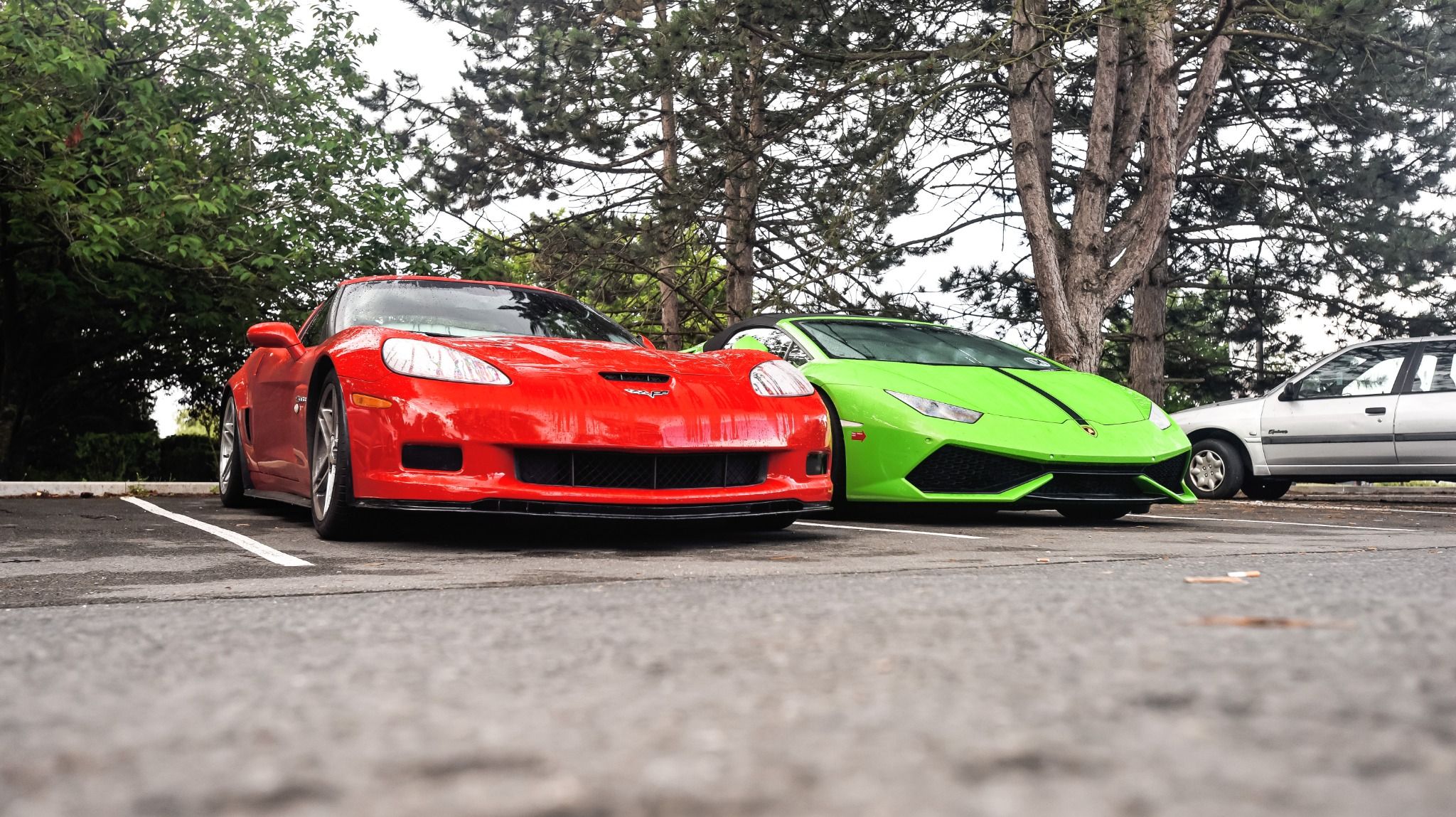 Red and Bright green sport cars parked