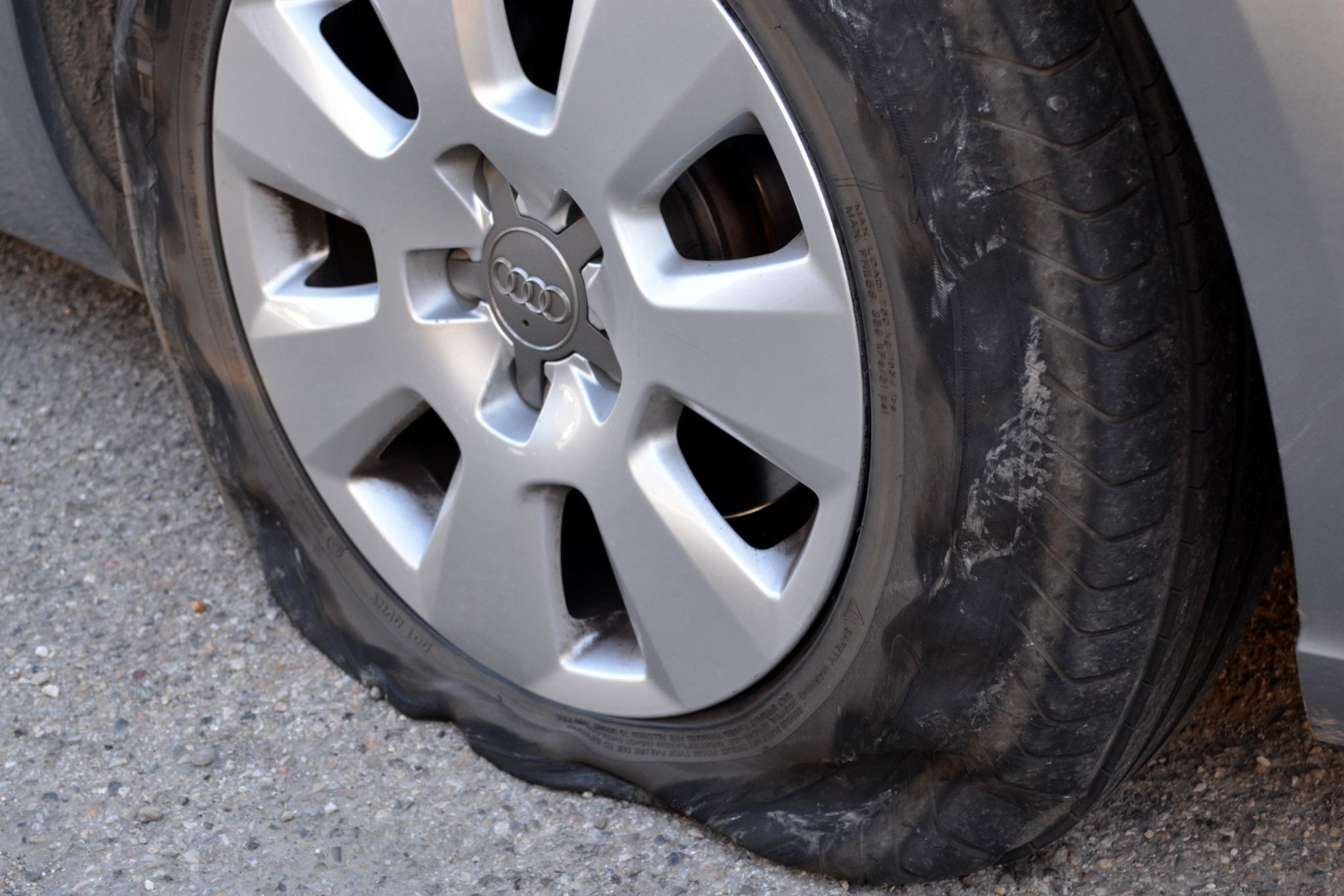 Close up of a flat tyre on a car