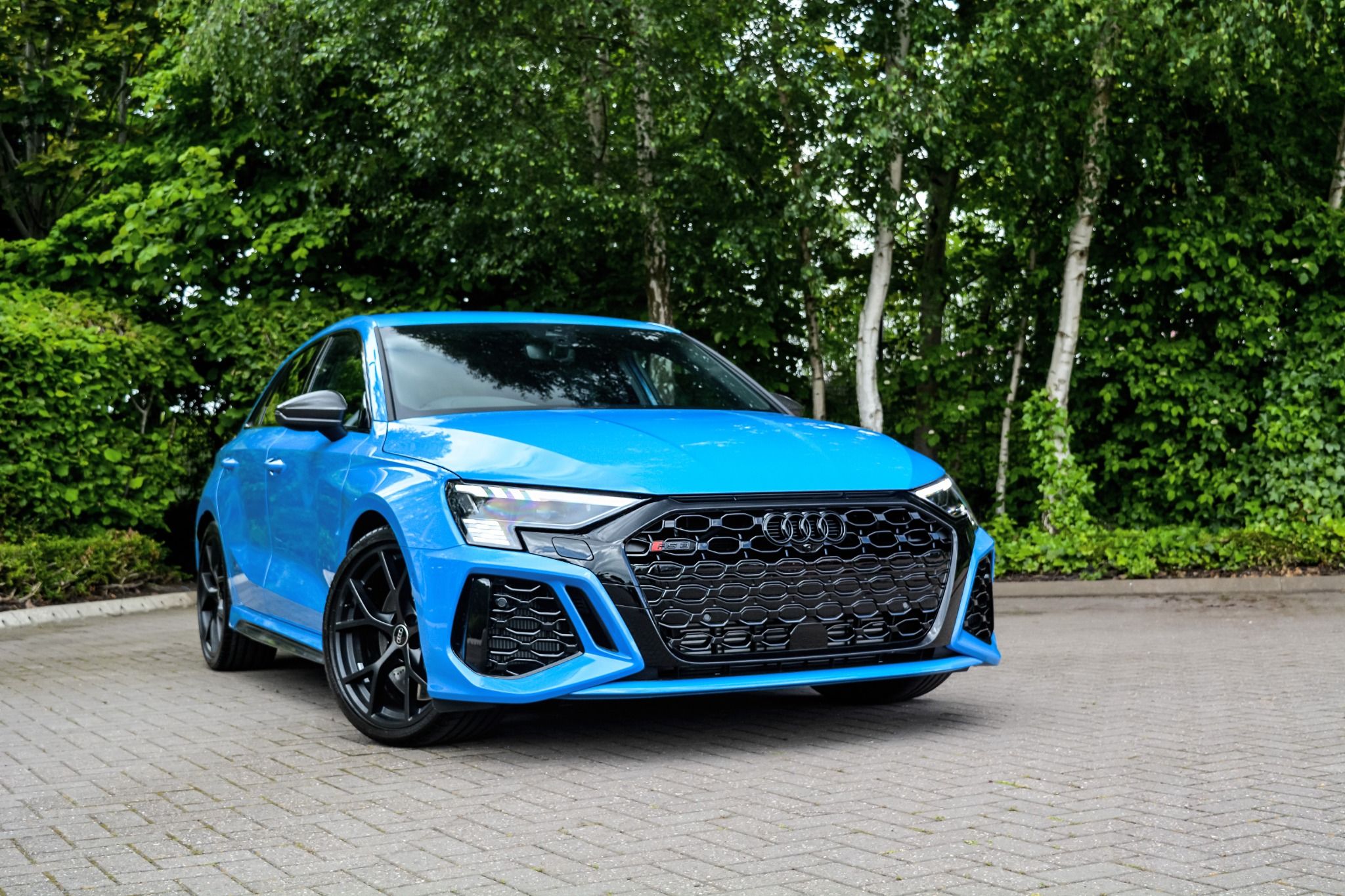 Front view of a Bright Blue Audi RS3 Sportback model