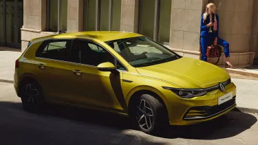 Yellow Volkswagen Golf MK 8 Parked on the side of the street