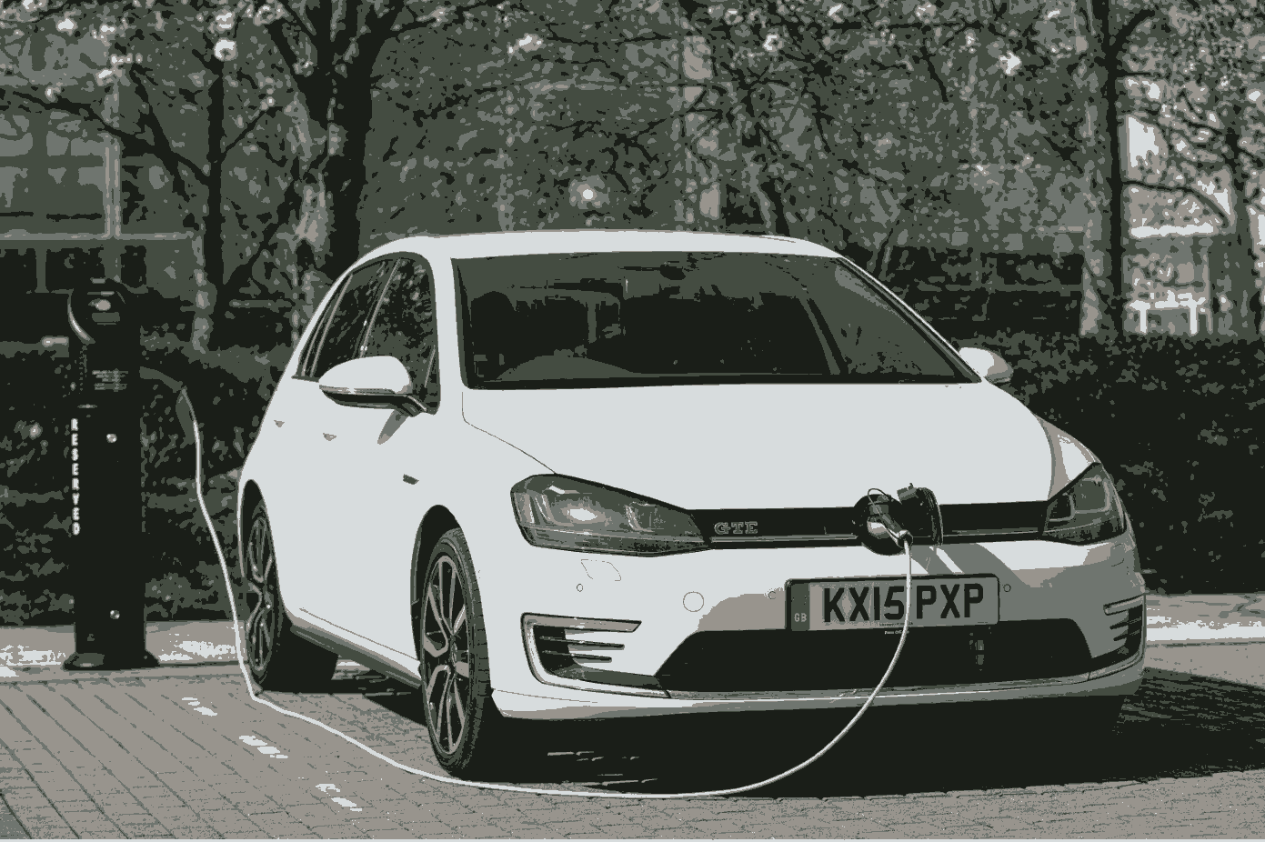 White Volkswagen Golf GTE on charge