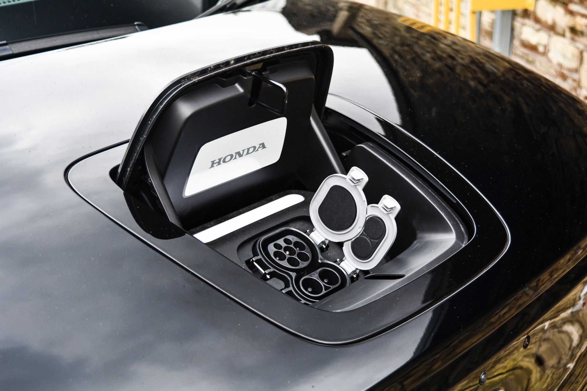 Black Honda e exterior bonnet charging port close up
