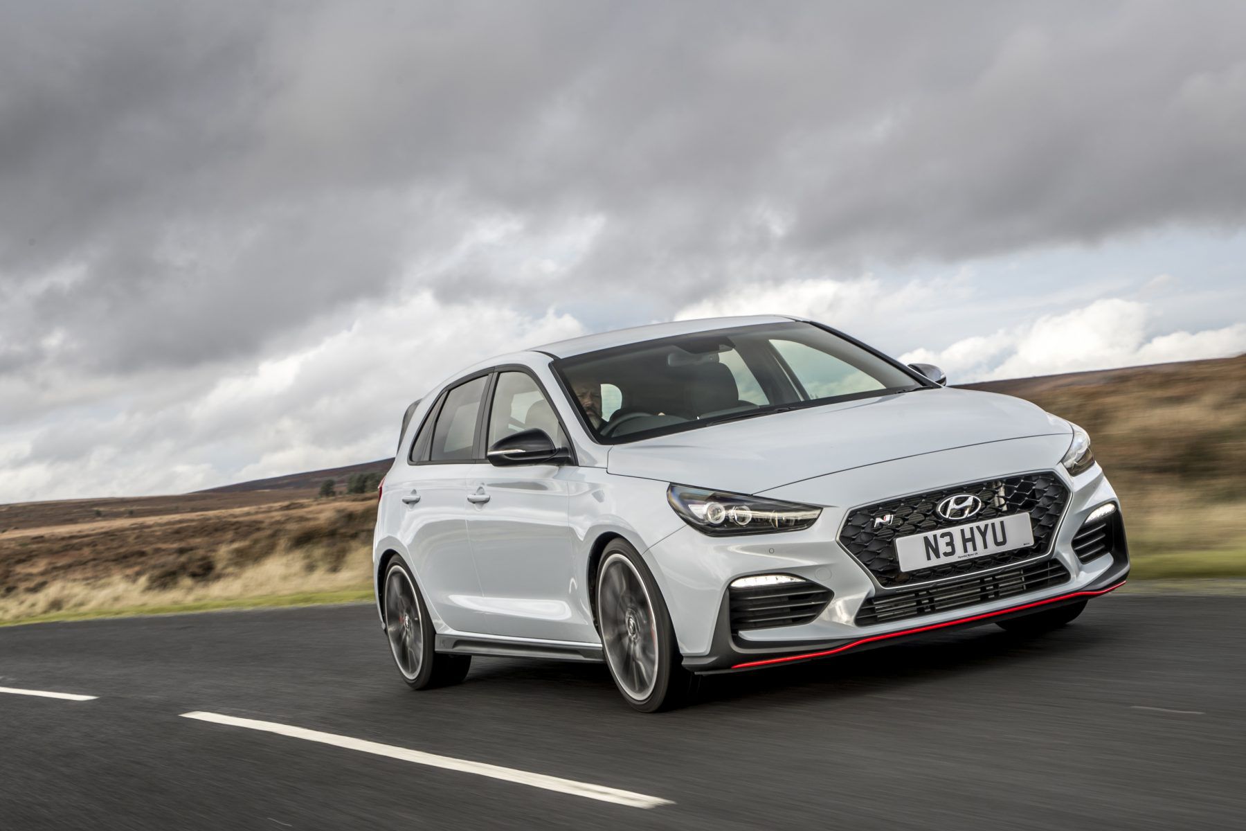 Front view of a Hyundai i30 N driving down the road