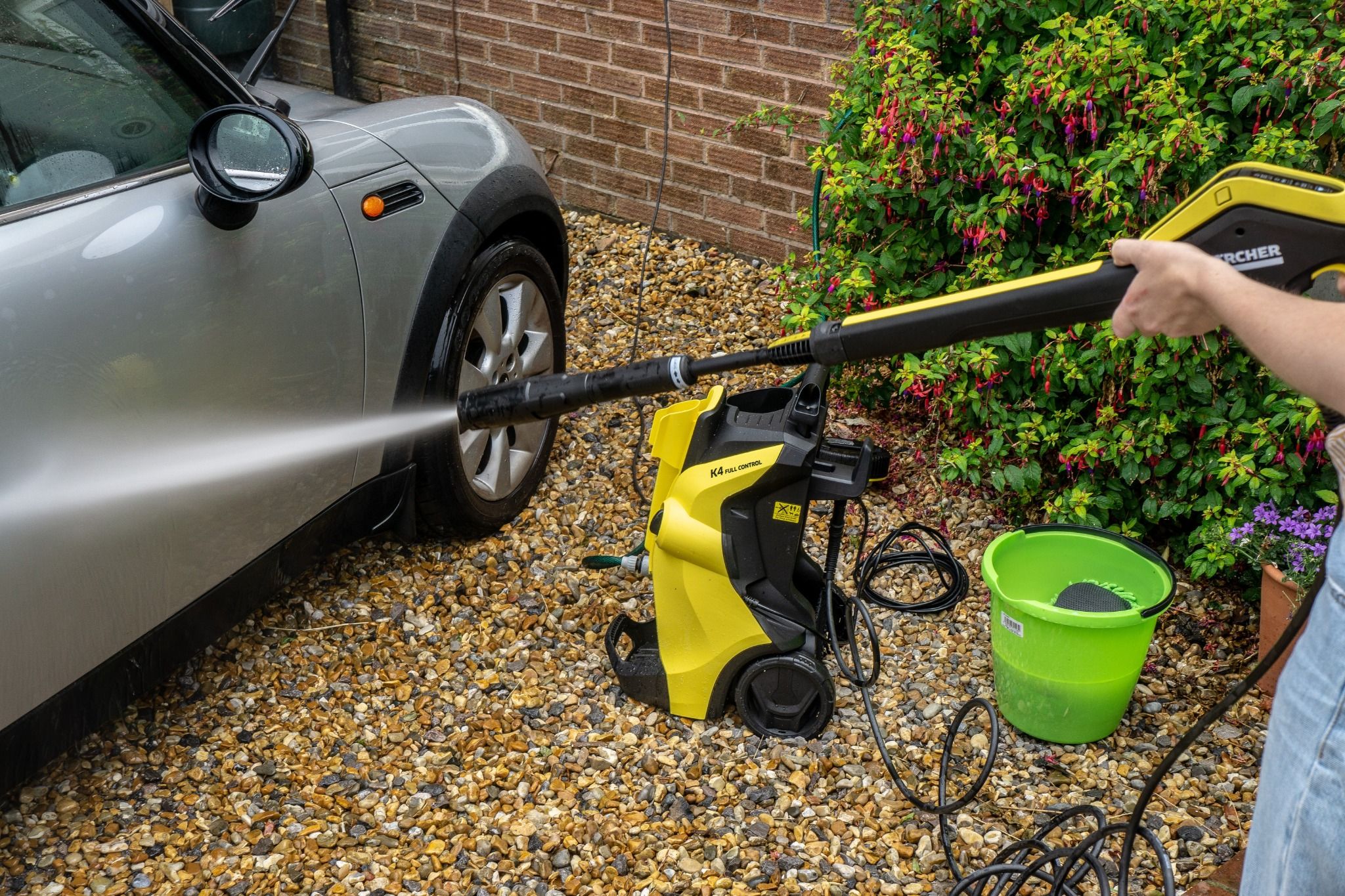 Karcher washer cleaning a car