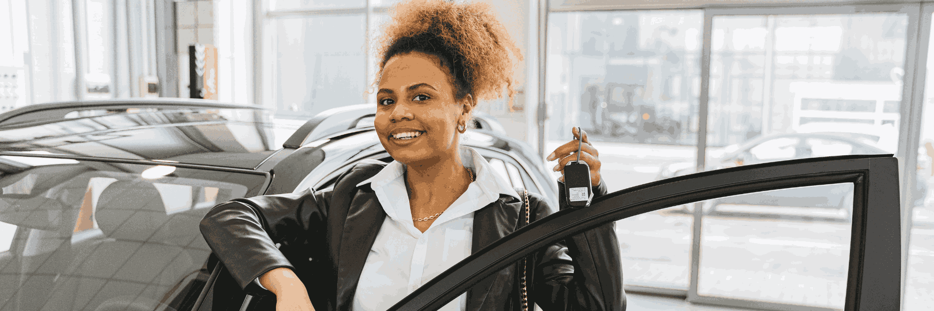 Lady Smiling with the Keys to her New Car