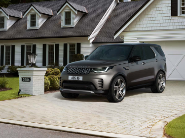 Image of grey Land Rover Discovery parked on a drive way