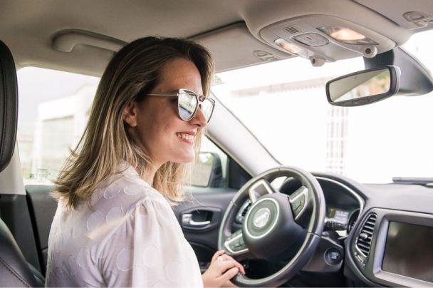 Woman smiling while driving
