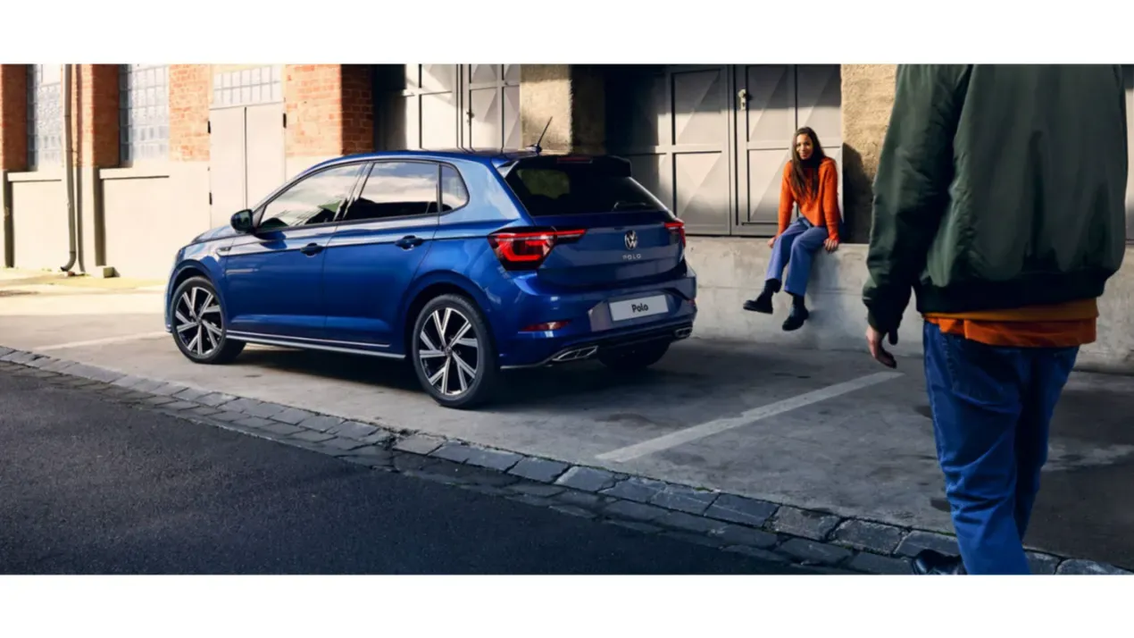 Side view of blue Volkswagen Polo parked on a street