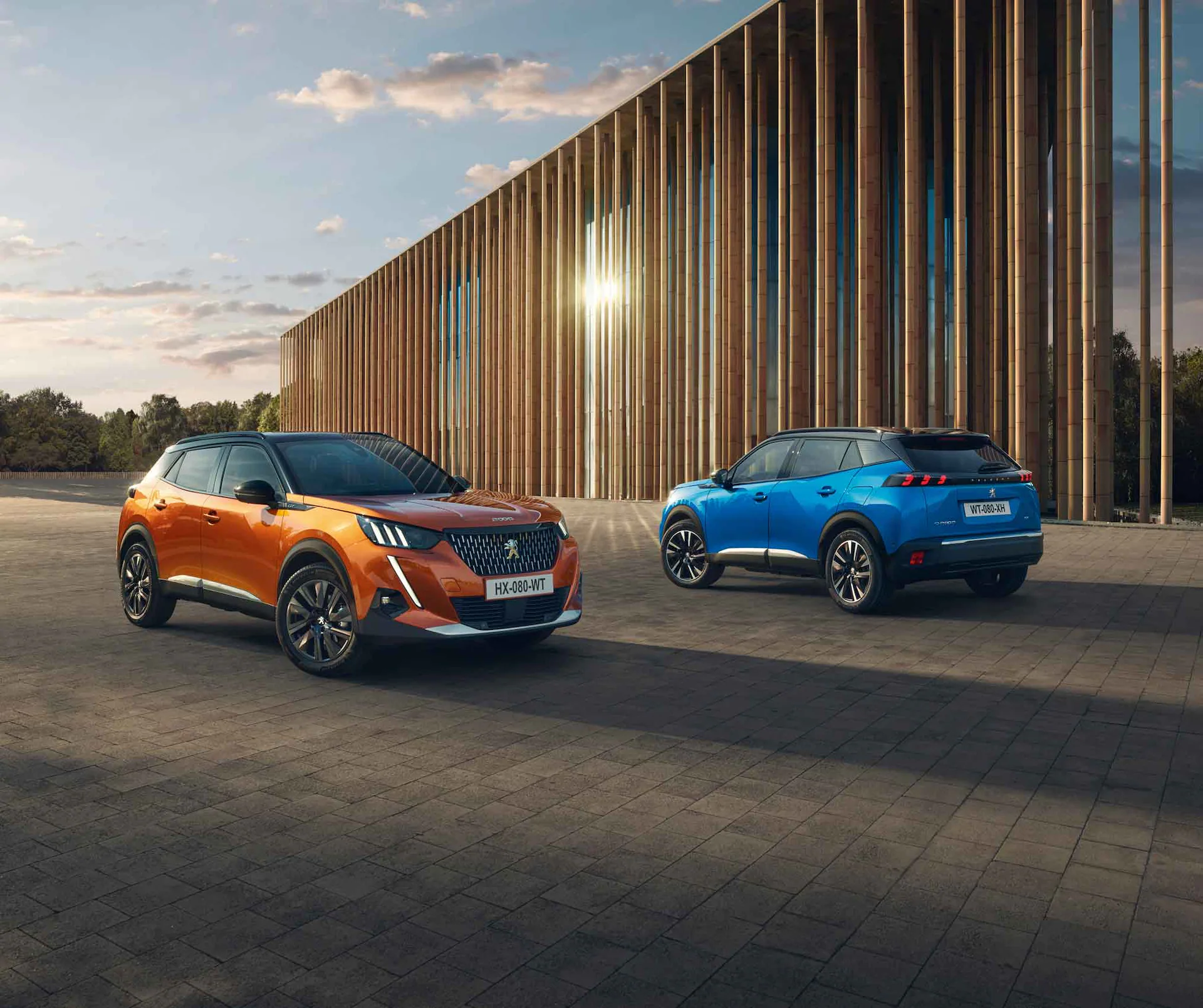 Orange and Blue Peugeot 2008 exterior of front and rear parked