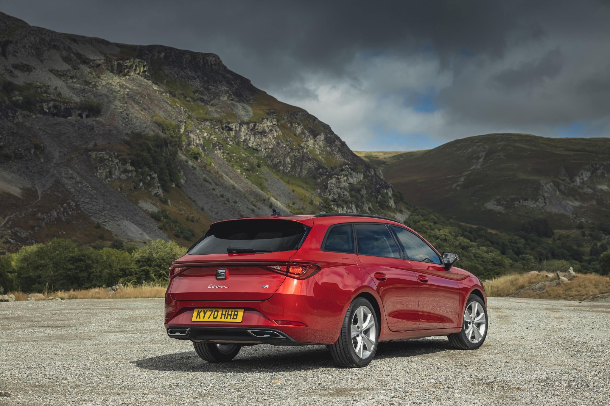 Red SEAT Leon Estate rear parked