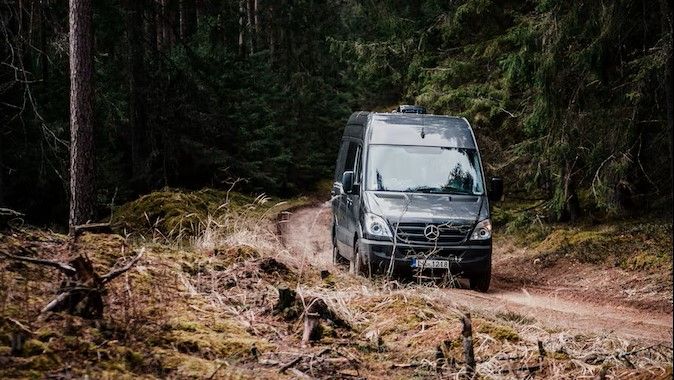 Mercedes Sprinter Van in the woods