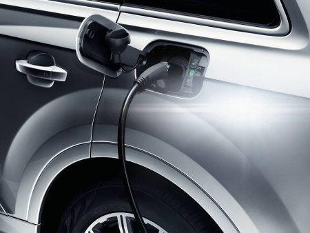 Close up ofAudi Q7 etron charging port with Charging cable plugged in