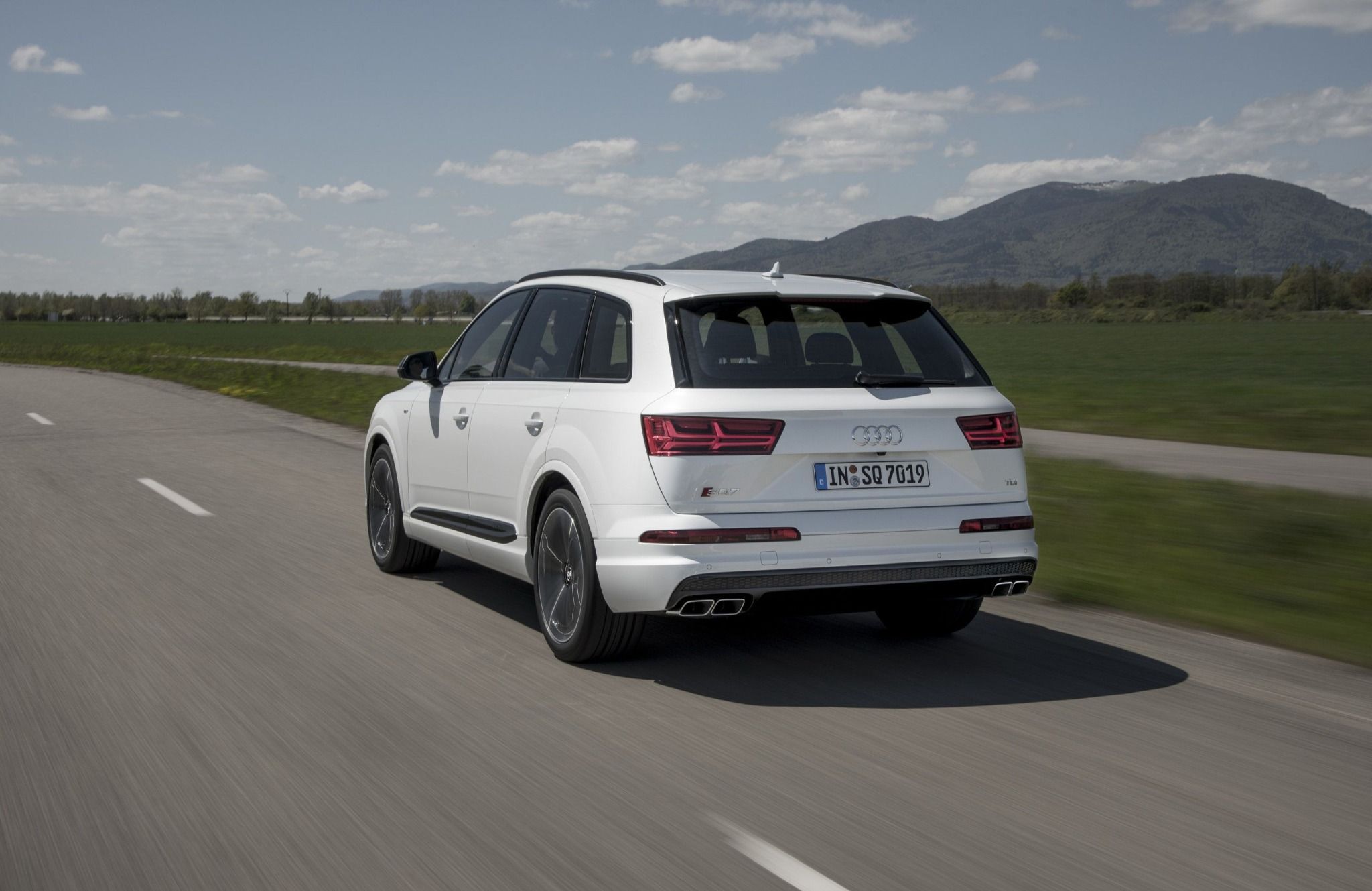 rear of white sq7 driving on a road