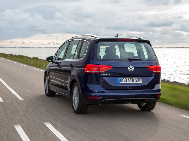 rear view of vw touran driving on a road
