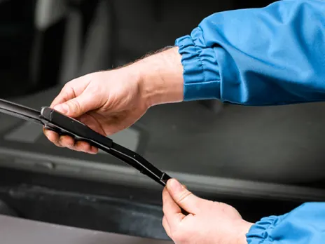 Person changing wiper blades