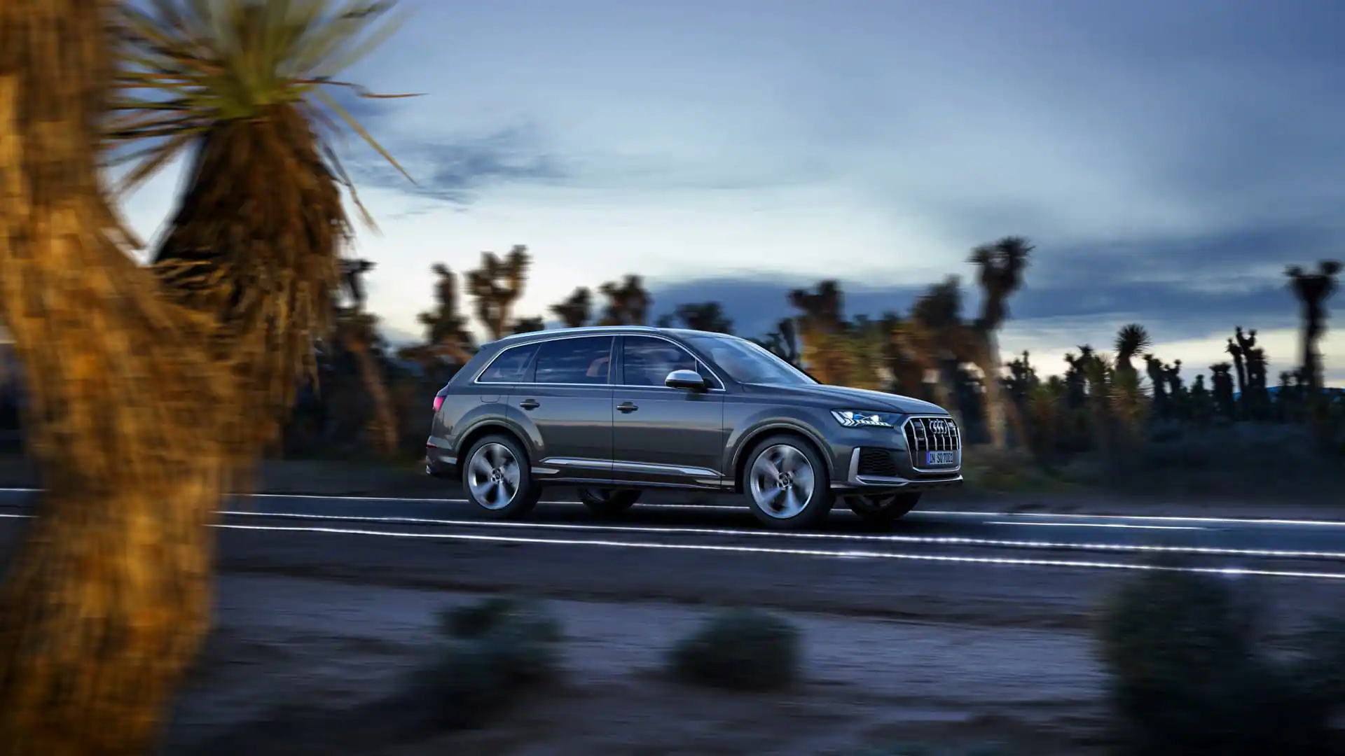 side view of sq7 driving on a road