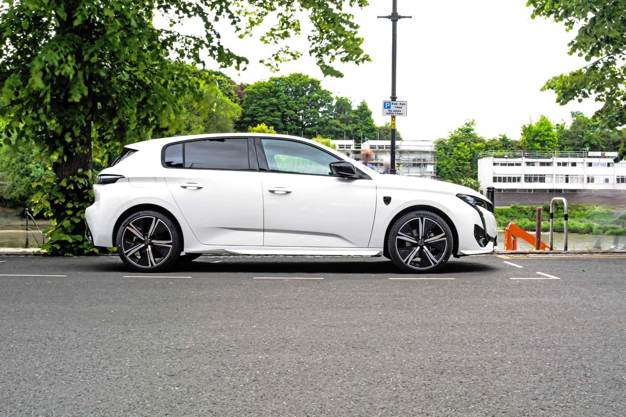 Side view of white Peugeot 308.