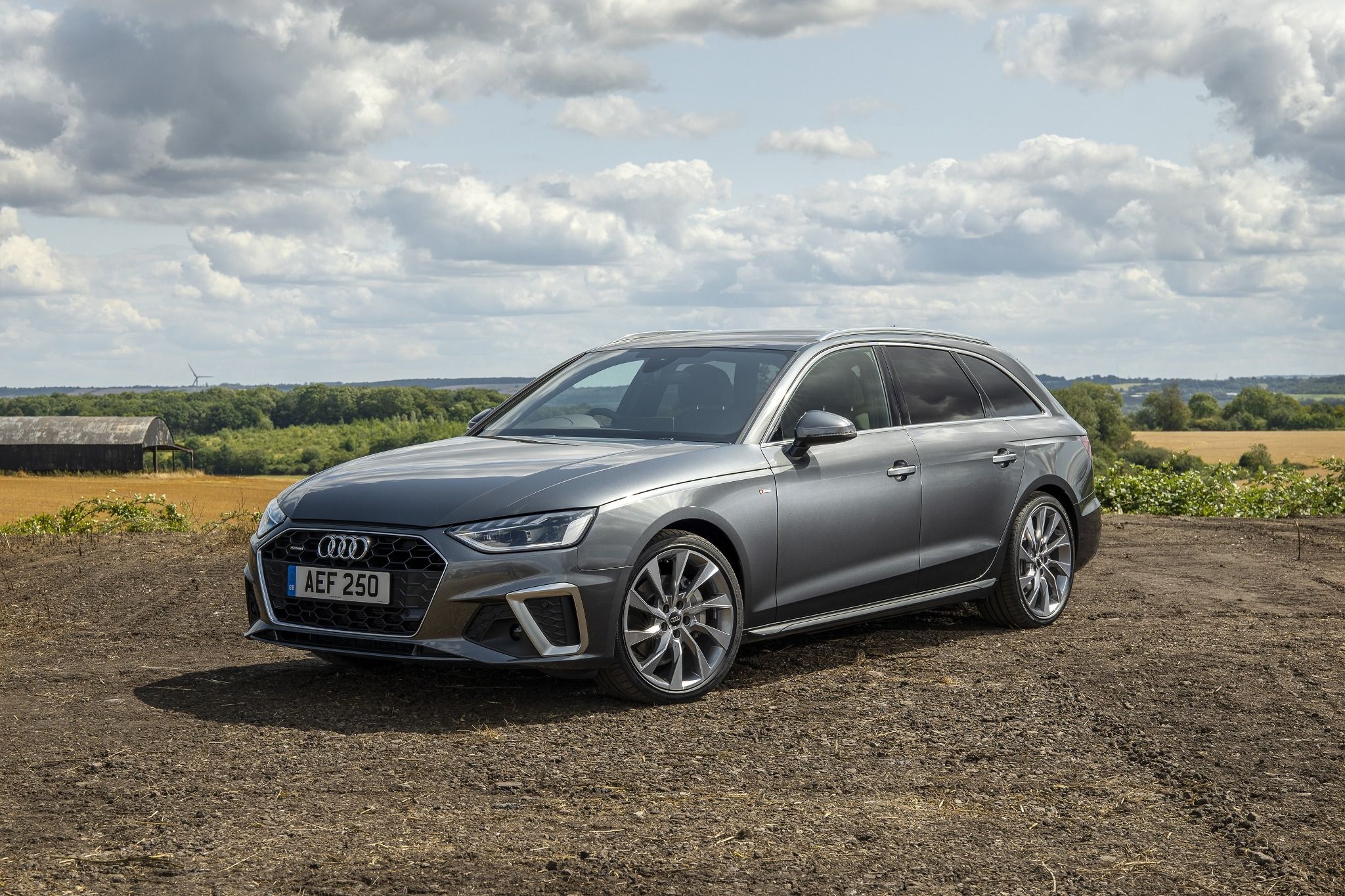 Audi A4 Avant in grey parked on gravel