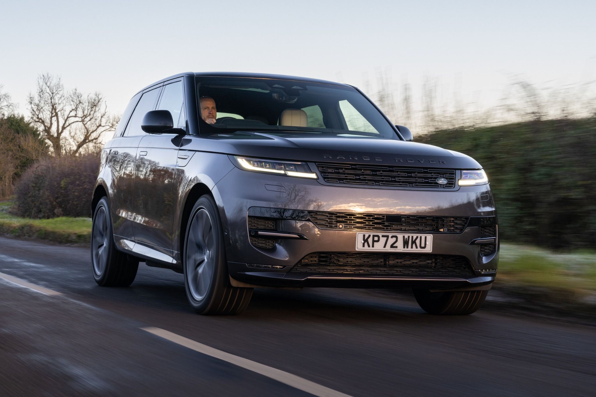 Front view of Range Rover sport driving on a road