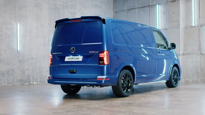 Blue volkswagen transporter sportline with black alloy wheels, rear profile view