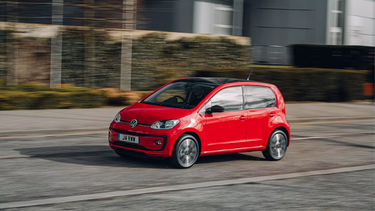 Red Volkswagen UP exterior side view parked