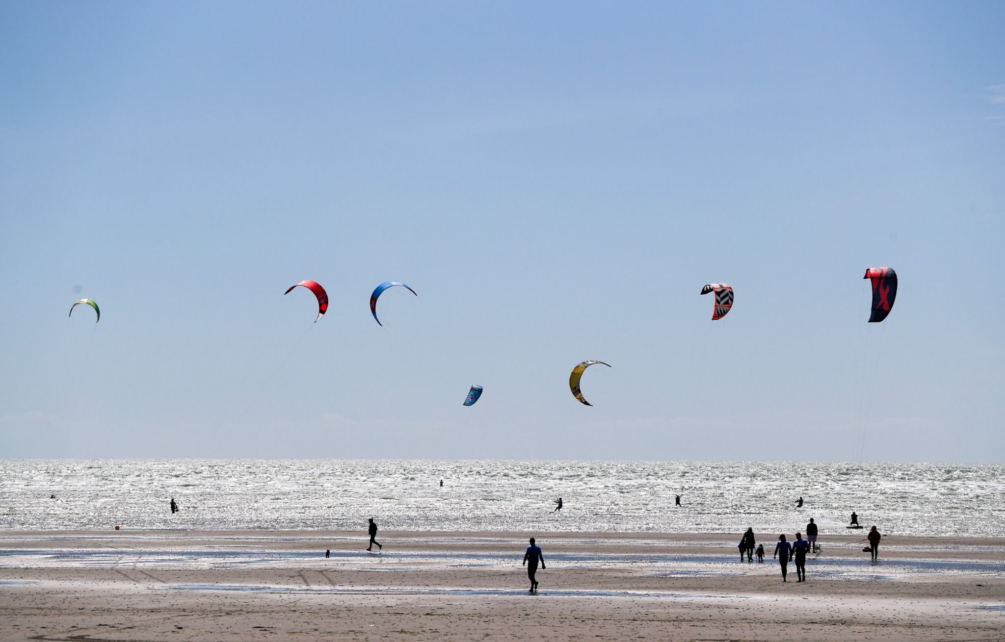 kite's flying on a beach in west wittering