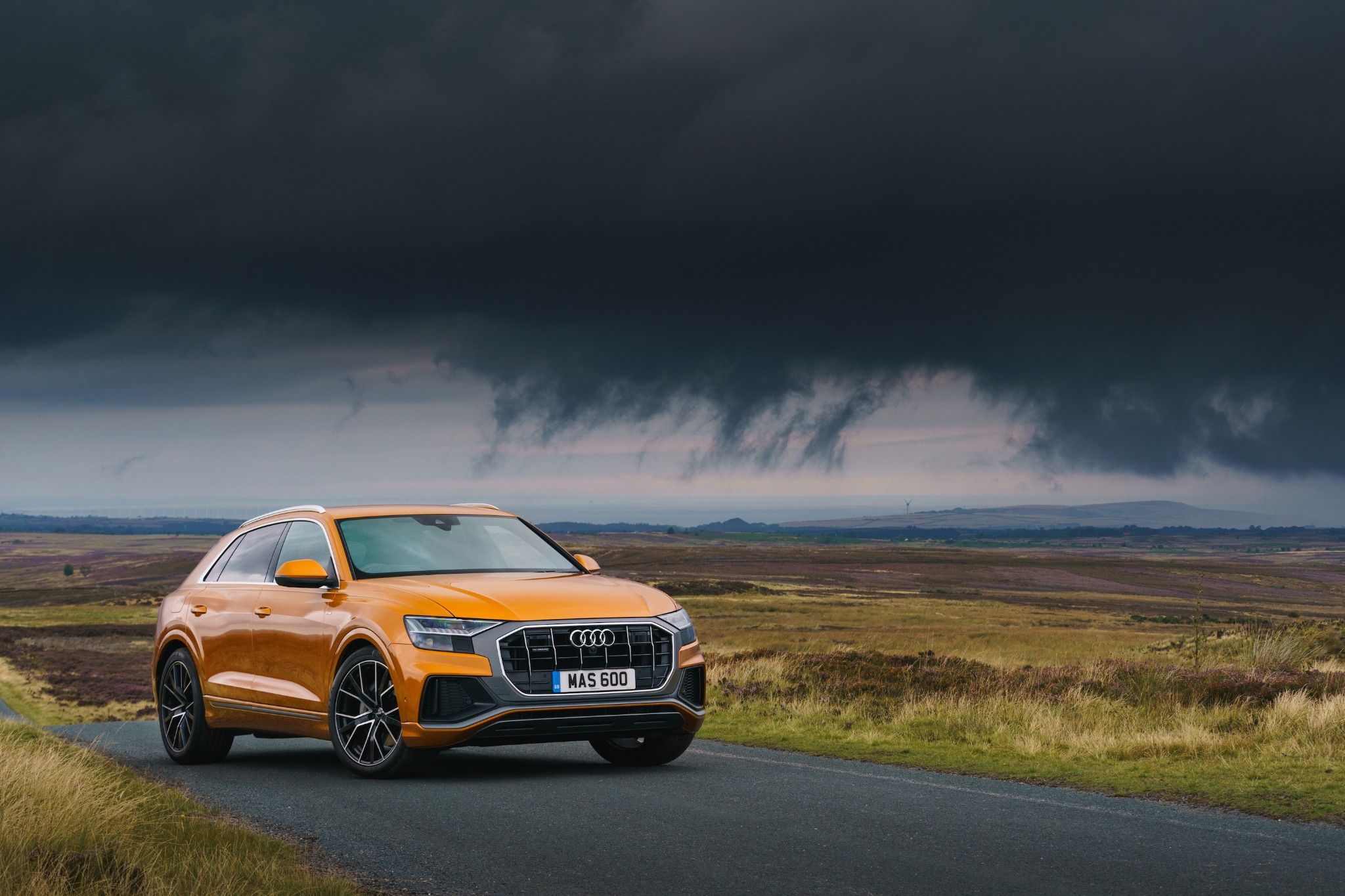 audi q8 with a stormy sky