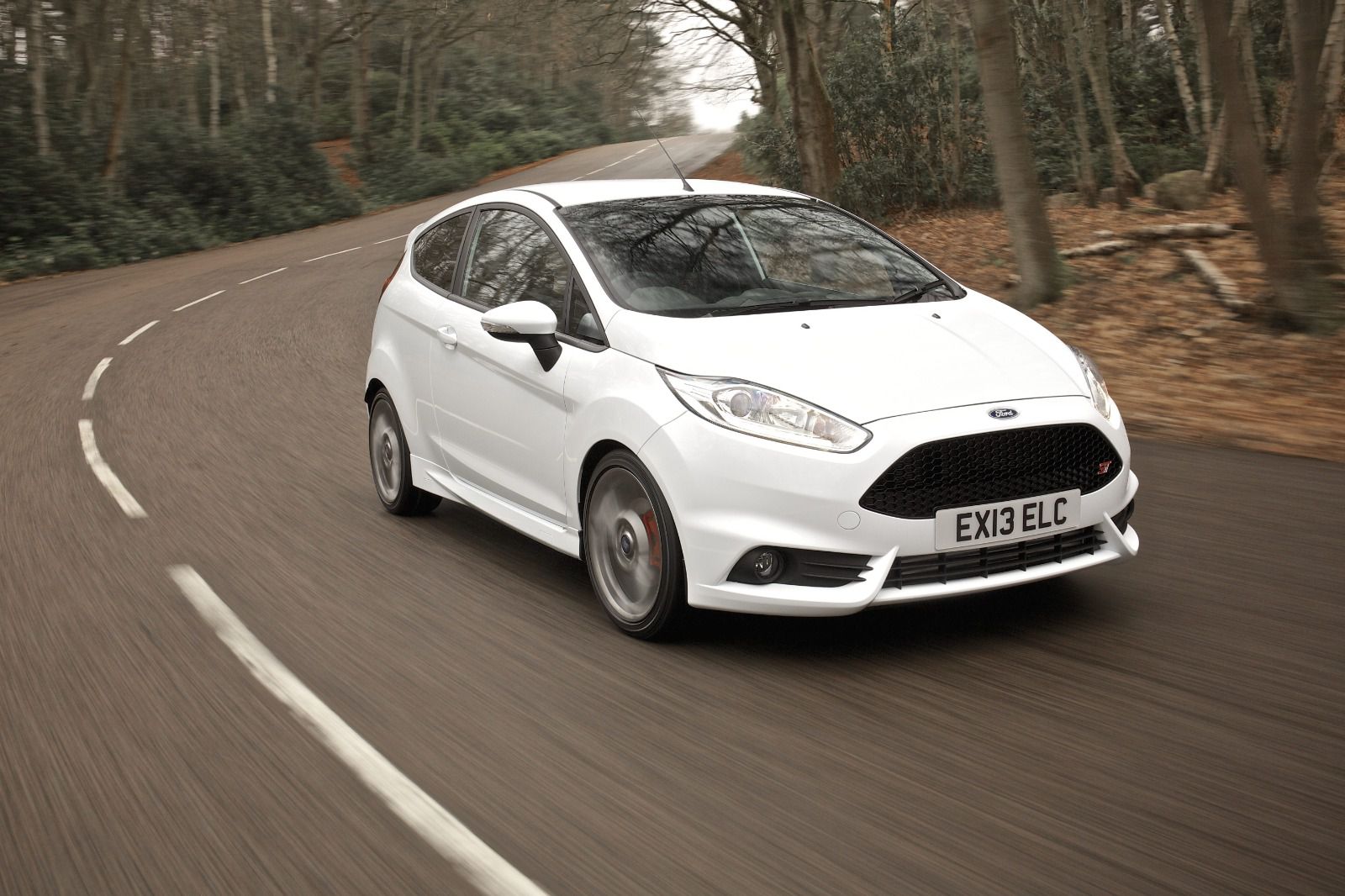 White ford fiesta ST driving on a road