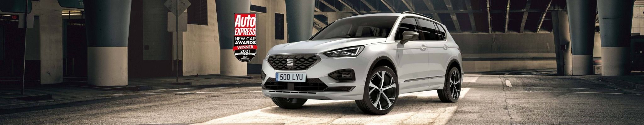 white seat tarraco parked in warehouse