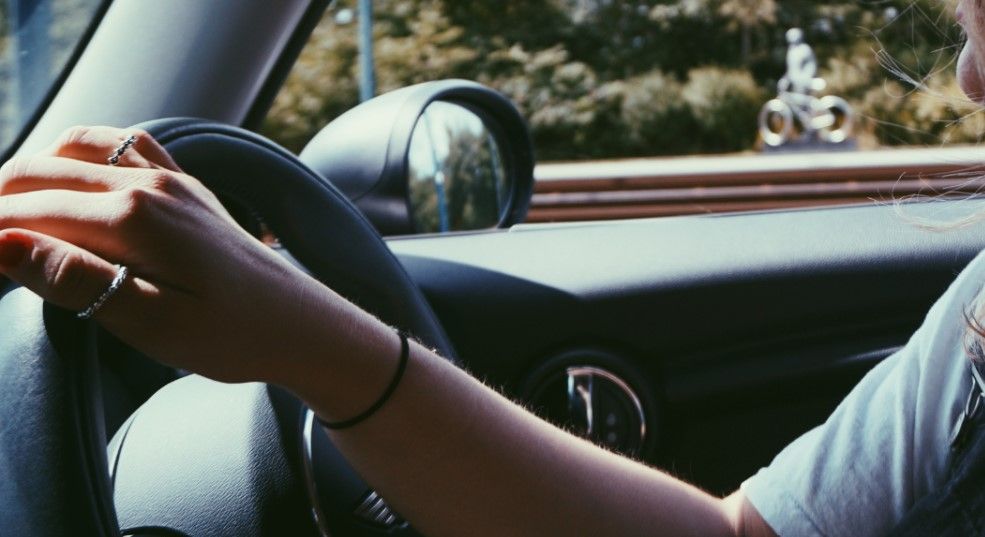 women driving in car
